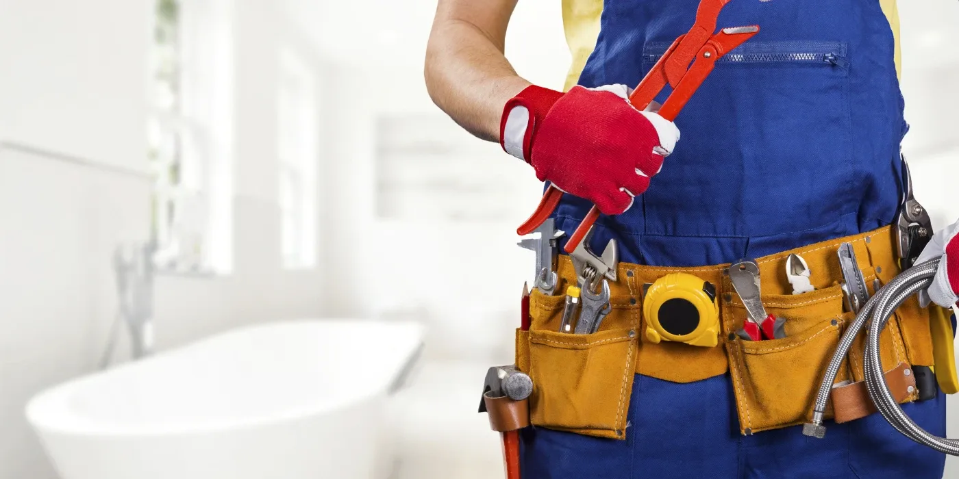 The torso of plumbing technician showing a tool belt from Dallas TX Plumbing in Dallas, TX - Commercial plumbing services